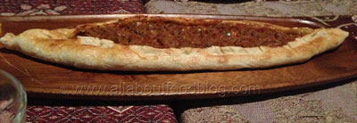Kiymali Pide – Turkish pizza with lamb mince, tomato, onion, parsley, red capsicum, green chilli, sweet chilli & garlic