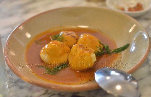 Ricotta gnudi with lobster sauce