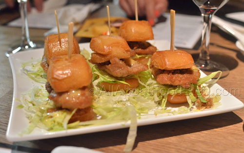 Macanese style mini burger filled with pork fillet, pork floss, lettuce and a sweet chilli mayo dressing