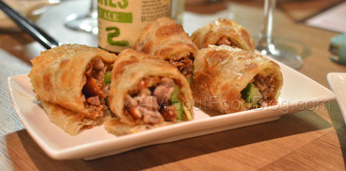 Shredded peking duck with cucumber, hoisin sauce rolled inside a fluffy Chinese roti