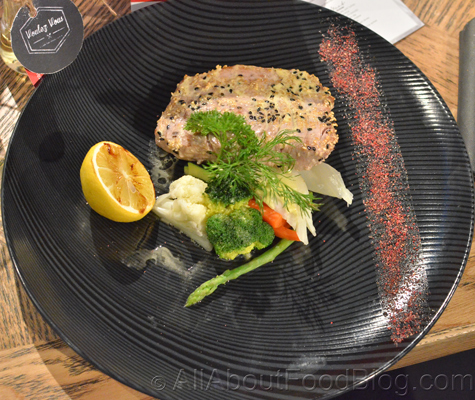 Sesame coated tuna steak with steamed vegetables