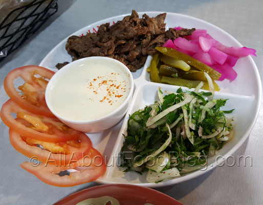 Shawarma plate - 1200- marinated Beef, parsley, onion, pickles, tomato, tahini and bread