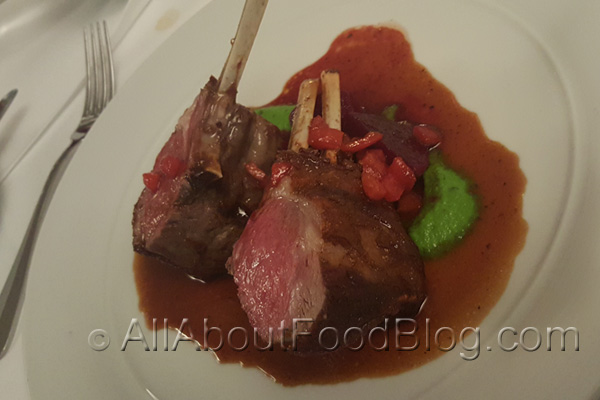 Roasted lamb rack with minted pea puree, baby beetroots & tomato jus